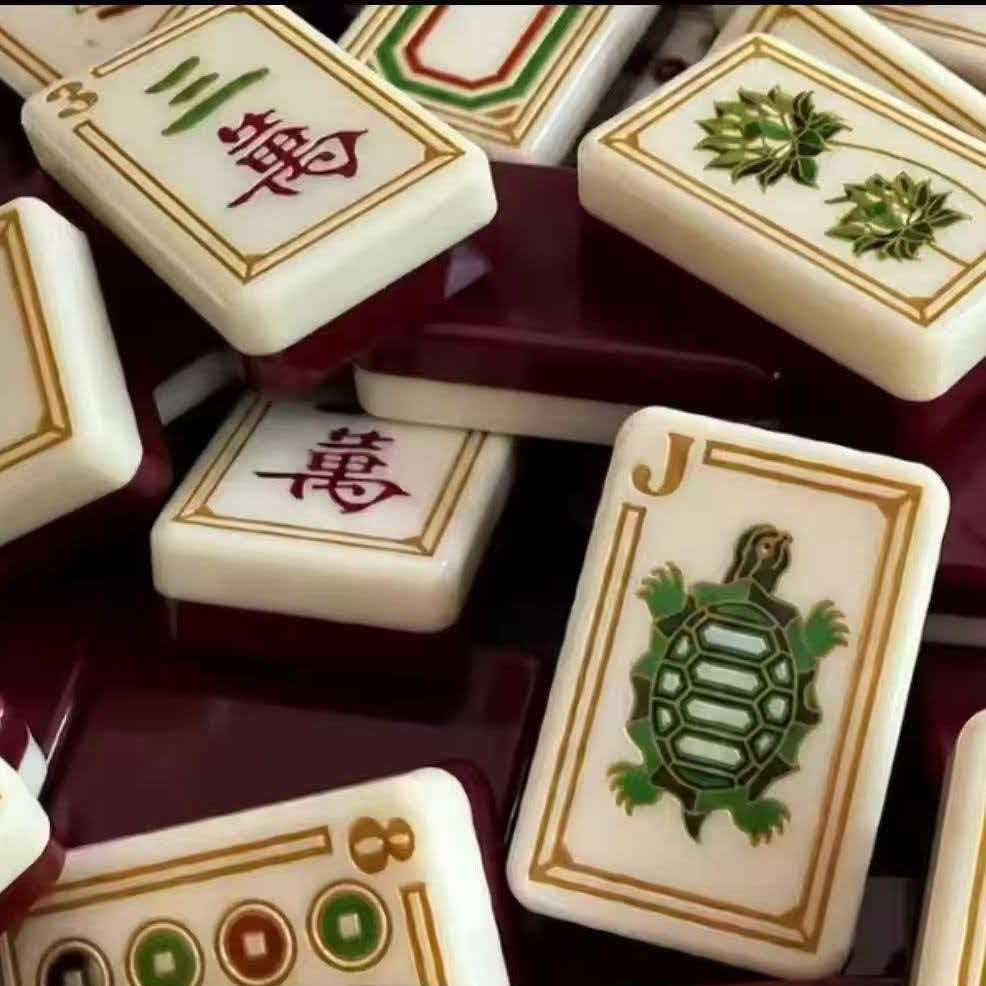 Imperial Grove mahjong detail view, turtle joker tile, character suit tiles, gold decorative framing, deep burgundy glossy backs, heritage‑themed American mahjong tiles