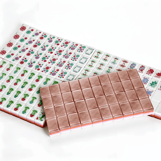 Rose Quartz American Mahjong Set by USA Mahjong Co. with 166 pink marbled acrylic tiles featuring gold inlays.
