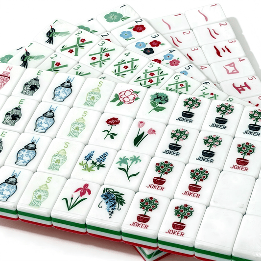 American Mahjong Set by USA Mahjong Co. with 166 weighted acrylic tiles featuring bold ruby red backs and Jokers.