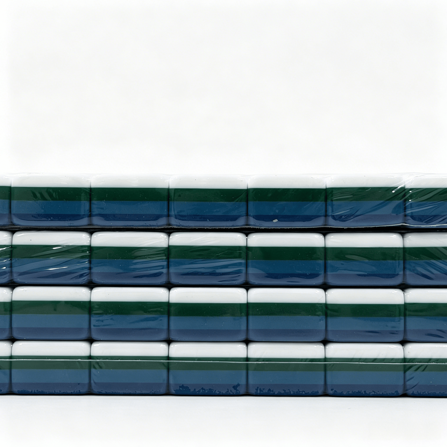 Side profile of 32g weighted teal Mahjong tiles with deep petrol backs from the USA Mahjong Co. American Mahjong Set.