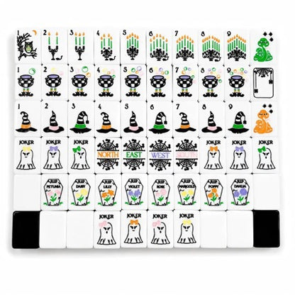 Spooky Hallow Mahjong Tiles Set — Solid black backs, white tile fronts decorated with ghost jokers, witch hats, magic cauldrons, owls, spider‑web winds and coffin‑floral Halloween‑themed American mahjong tiles