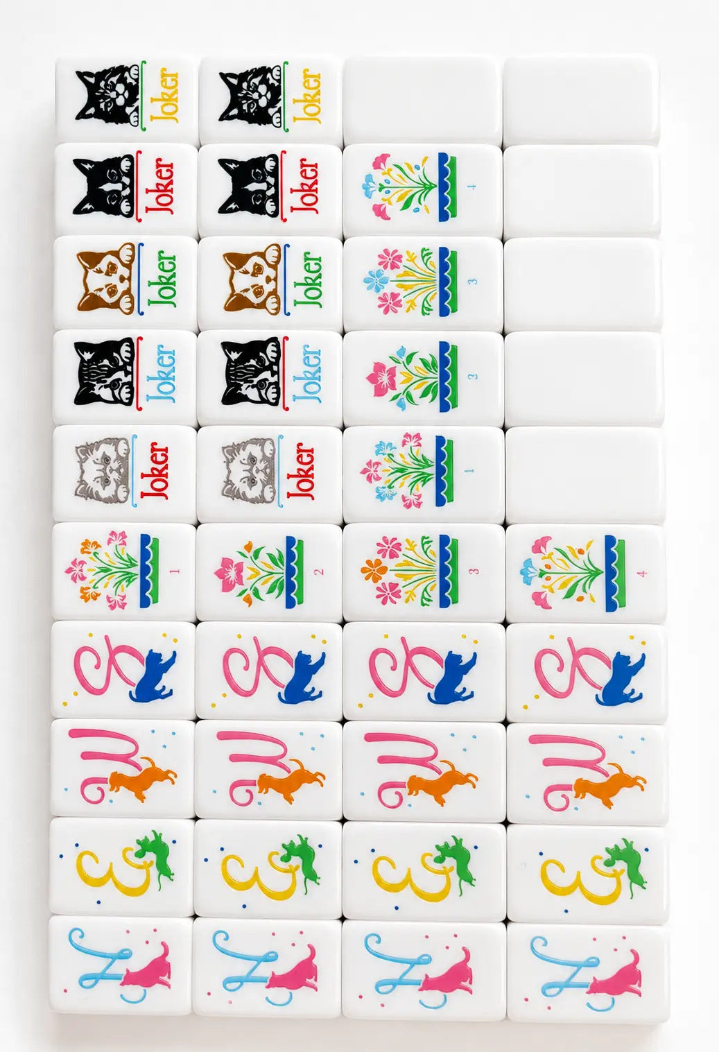Piled cute pet themed mahjong tiles on light purple marble surface, white tile faces with dog, cat, paw print, bird and pet house illustrations, solid pink tile backs