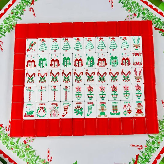 Christmas Cheer mahjong full flat‑lay layout, complete 160‑tile holiday set, christmas tree, gift box, candy cane, reindeer and festive joker tiles, glossy solid red backs, American mahjong set