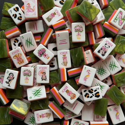Scattered Jungle Animal American mahjong tiles, white tiles with cute wildlife illustrations, green marbled backs and orange pink striped edges