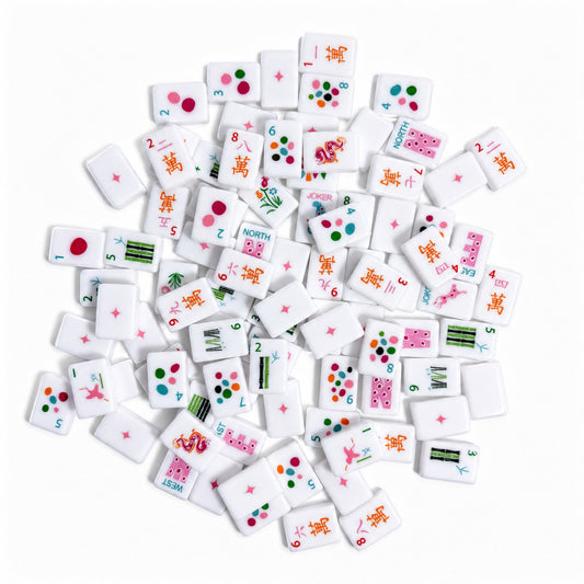 Leopard Bloom mahjong scattered tiles overhead shot, clean white tiles with colorful polka‑dot patterns, orange Chinese character tiles, green bamboo, pink leopard jokers and pink star‑accented tile backs, playful modern American mahjong tiles