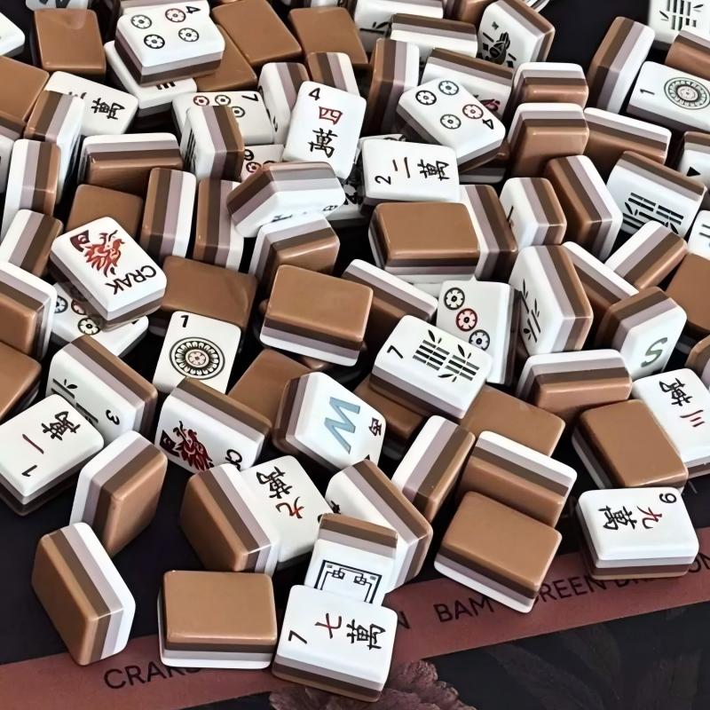 Wildwood Bear mahjong scattered close‑up view, mocha brown multi‑layer tile backs, wild flower suit tiles, dragon tile, nature‑themed custom American mahjong pieces