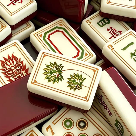 Evoking timeless oriental elegance, this Imperial Grove American mahjong set features luxe gold‑bordered cream tile faces decorated with classic East‑Asian wildlife and botanical art. Graceful cranes, symbolic turtle jokers, fierce dragon motifs, lush lotus florals and ornate fan‑styled wind tiles elevate every suit. Rich deep burgundy high‑gloss tile backs deliver a premium, sophisticated finished look.