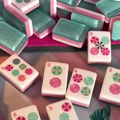 Tropical Floral mahjong tiles scattered on tropical palm mat, featuring decorative umbrella pattern dot tiles