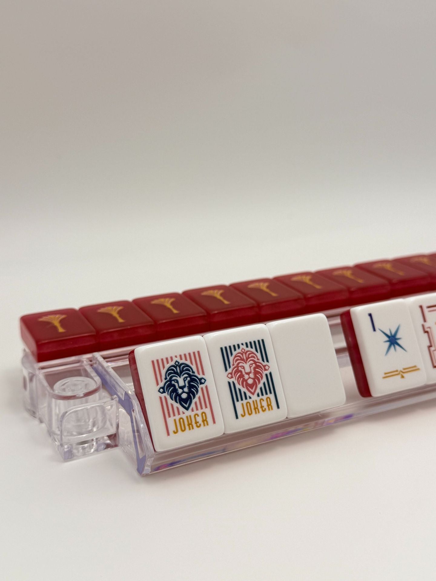 Crimson Lion Mahjong Tiles Set – Glossy Deep Burgundy Wine-Red Gold-Tassel Tile Backs with White Star-Sparkle Dot, Gold-Teal Bamboo, Red-Frame Character, Peacock-Feather Wind & Lion-Head Joker American Mahjong Suit Art