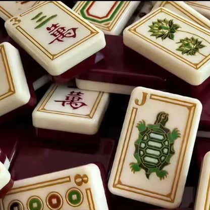 Imperial Grove mahjong detail view, turtle joker tile, character suit tiles, gold decorative framing, deep burgundy glossy backs, heritage‑themed American mahjong tiles
