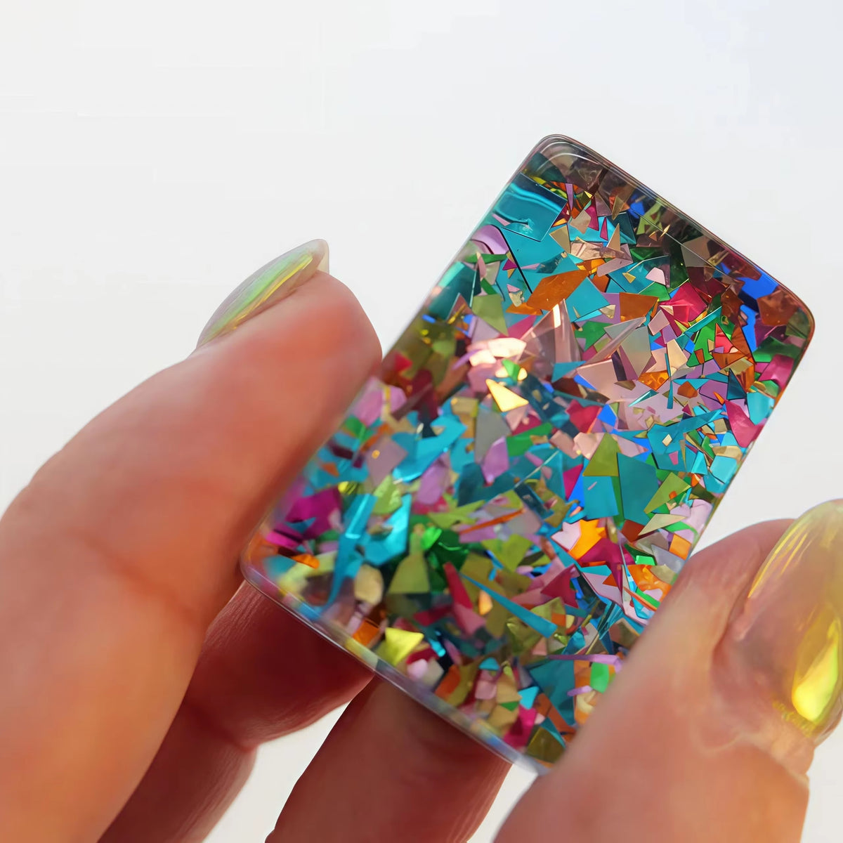 Scattered Confetti Sapphire American mahjong tiles on white background, deep blue resin tiles with embedded rainbow confetti flakes and bright neon pop art graphics