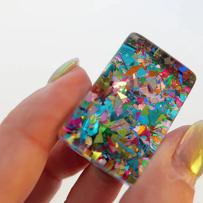 Scattered Confetti Sapphire American mahjong tiles on white background, deep blue resin tiles with embedded rainbow confetti flakes and bright neon pop art graphics