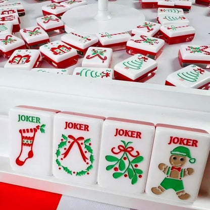 Christmas Cheer mahjong joker tiles close‑up view, stocking, wreath, mistletoe and gingerbread elf jokers, red‑green‑white holiday artwork, premium American mahjong pieces