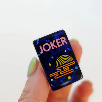 Scattered Confetti Sapphire American mahjong tiles on white background, deep blue resin tiles with embedded rainbow confetti flakes and bright neon pop art graphics