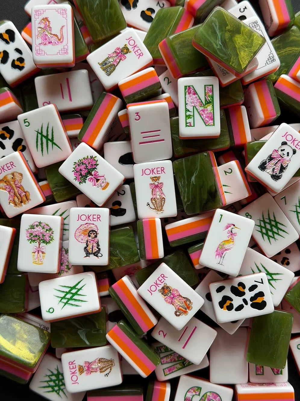 Scattered Jungle Animal American mahjong tiles, white tiles with cute wildlife illustrations, green marbled backs and orange pink striped edges
