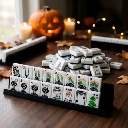 Spooky Hallow Mahjong Tiles Set — Solid black backs, white tile fronts decorated with ghost jokers, witch hats, magic cauldrons, owls, spider‑web winds and coffin‑floral Halloween‑themed American mahjong tiles