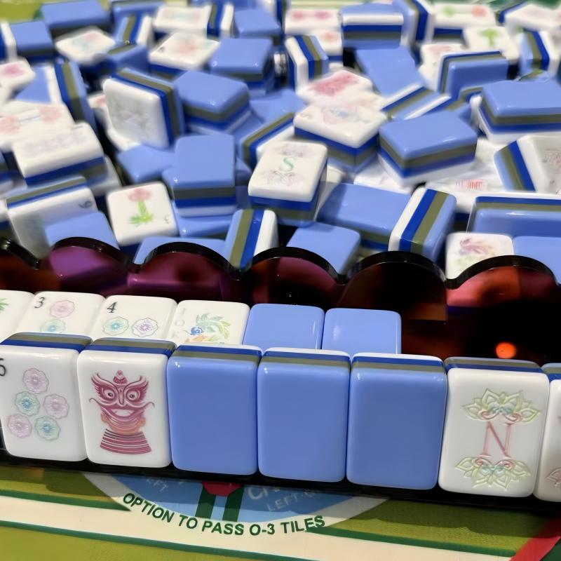 Lotus Lantern Mahjong Tiles Set — Glossy multi‑layer light‑blue backs, white tile faces with lantern‑styled characters, pastel florals, palm‑tree bamboos and decorative mask jokers, full 160‑tile American mahjong set