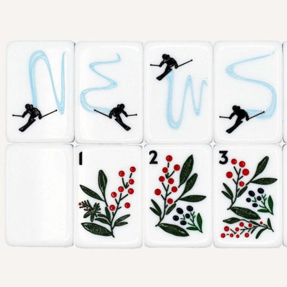 Frosty Peak mahjong wind and seasonal tiles close‑up, downhill skier wind tiles, winter berry floral tiles, winter alpine artwork, custom American mahjong tile details