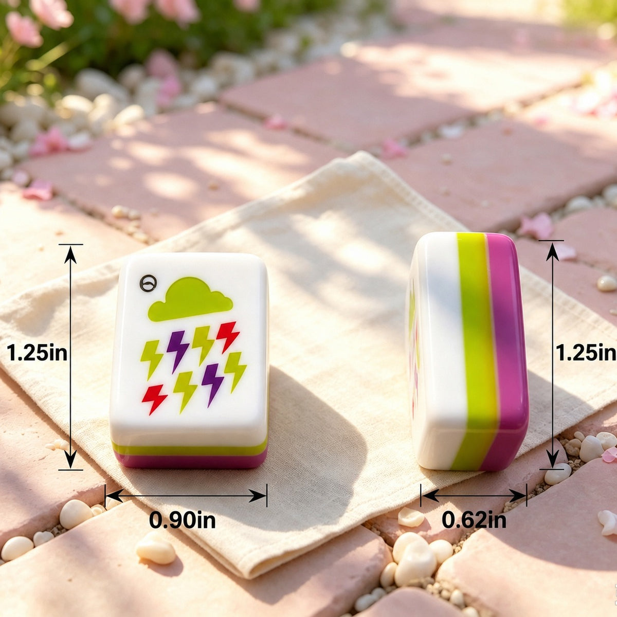 Overhead scattered pile of Strawberry Bow mahjong tiles on white background, showing glossy hot pink backs, colorful striped edges, white tile faces with strawberry heart, green bow and fruit number illustrations