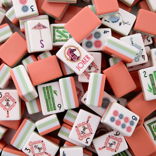 Bursting with soft spring‑time folk‑art charm, this American mahjong set stands out with warm peach‑coral solid backs and eye‑catching mint‑peach striped side edges. Crisp ivory tile fronts are decorated with playful Asian‑inspired illustrations: lion dance figures, decorative paper umbrellas, cranes, tassel‑hung wan tiles, lush seasonal blossoms and traditional pavilion details.