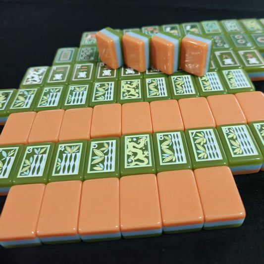 Retro_Harvest_Mahjong_Tiles_Set_Glossy_Burnt-Orange_Retro_Striped_Tile_Backs_with_Avocado-Green_Peacock-Eye_Dot