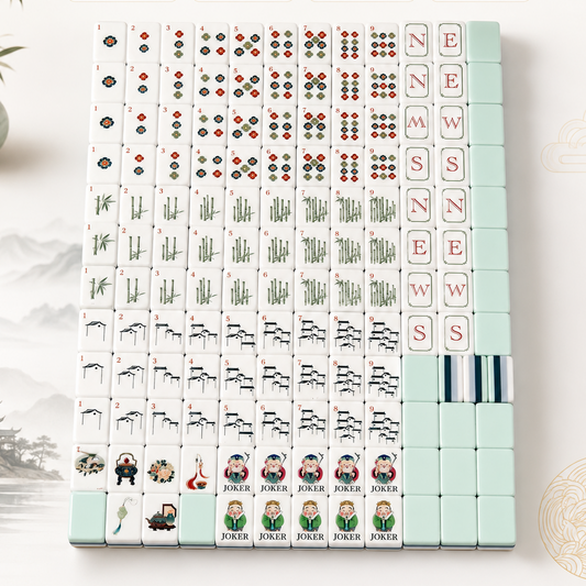 Top-down view of mixed pile of Chinese Sage themed mahjong tiles on white surface, featuring mint green acrylic backs, floral dots, bamboo stalks, ancient architecture cracks and sage character jokers