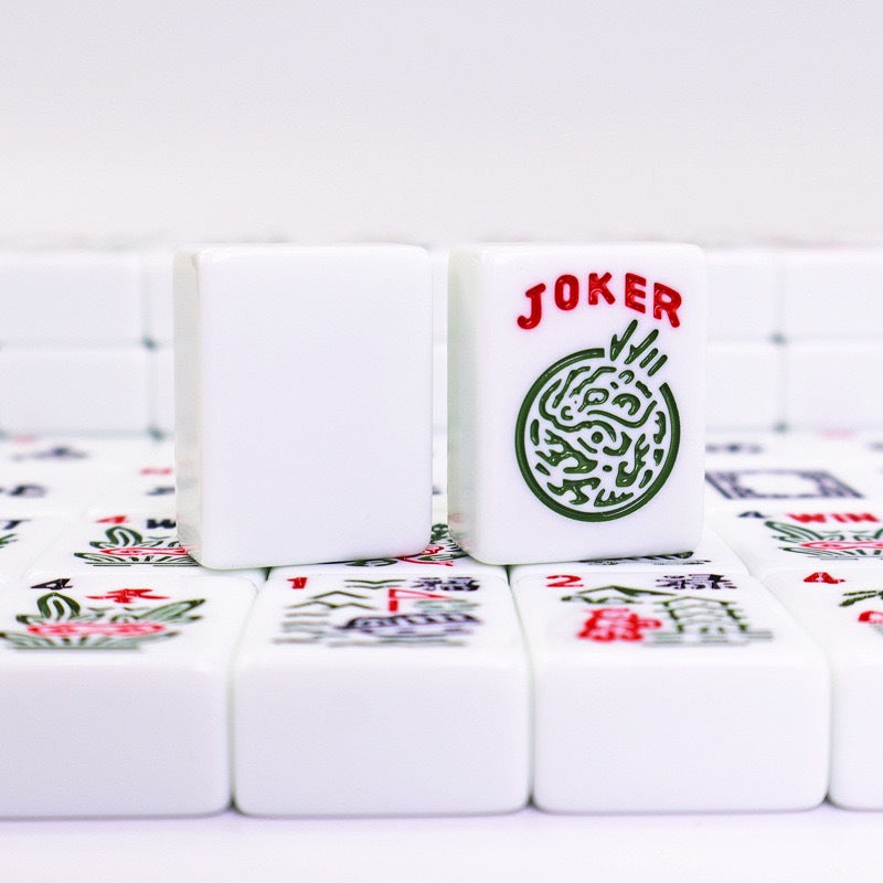 Close-up of 30mm American Mahjong tiles with engraved symbols from USA Mahjong Co., featuring a standard set with 166 premium melamine tiles.