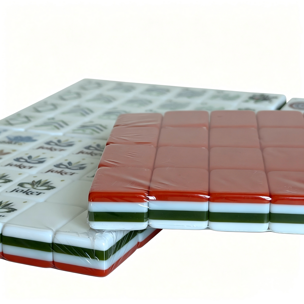 Detailed View of Coral Reef Mahjong Tiles - Vibrant Sunset Red Acrylic with Elegant Gold Inlays