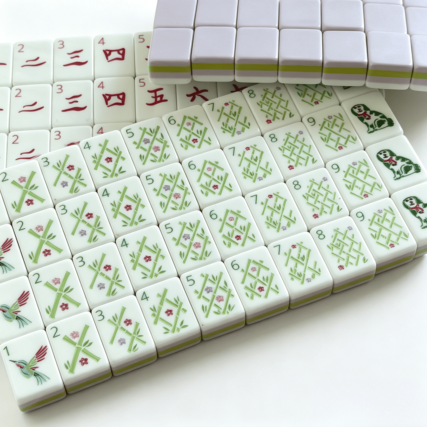 The Wisteria Bloom American Mahjong Set by USA Mahjong Co. with 166 soft purple tiles featuring gold and white inlays