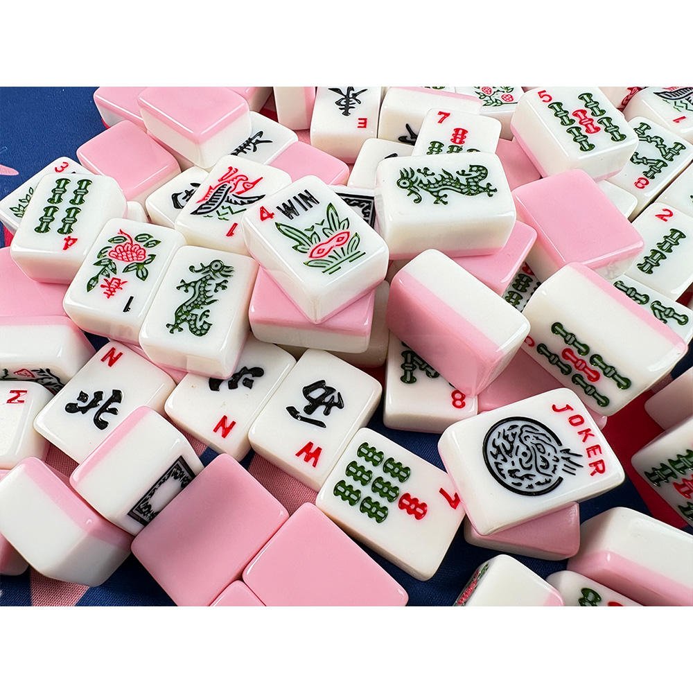 White Melamine Mahjong Tiles with Pink Backs Close-up - Dragon Flower and Wind Tiles NMJL Standard