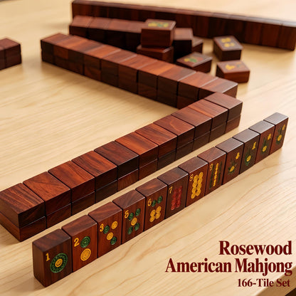 Solid red wood American mahjong set laid out for gameplay, wooden mahjong tiles with dragon embroidered coasters on light wood surface
