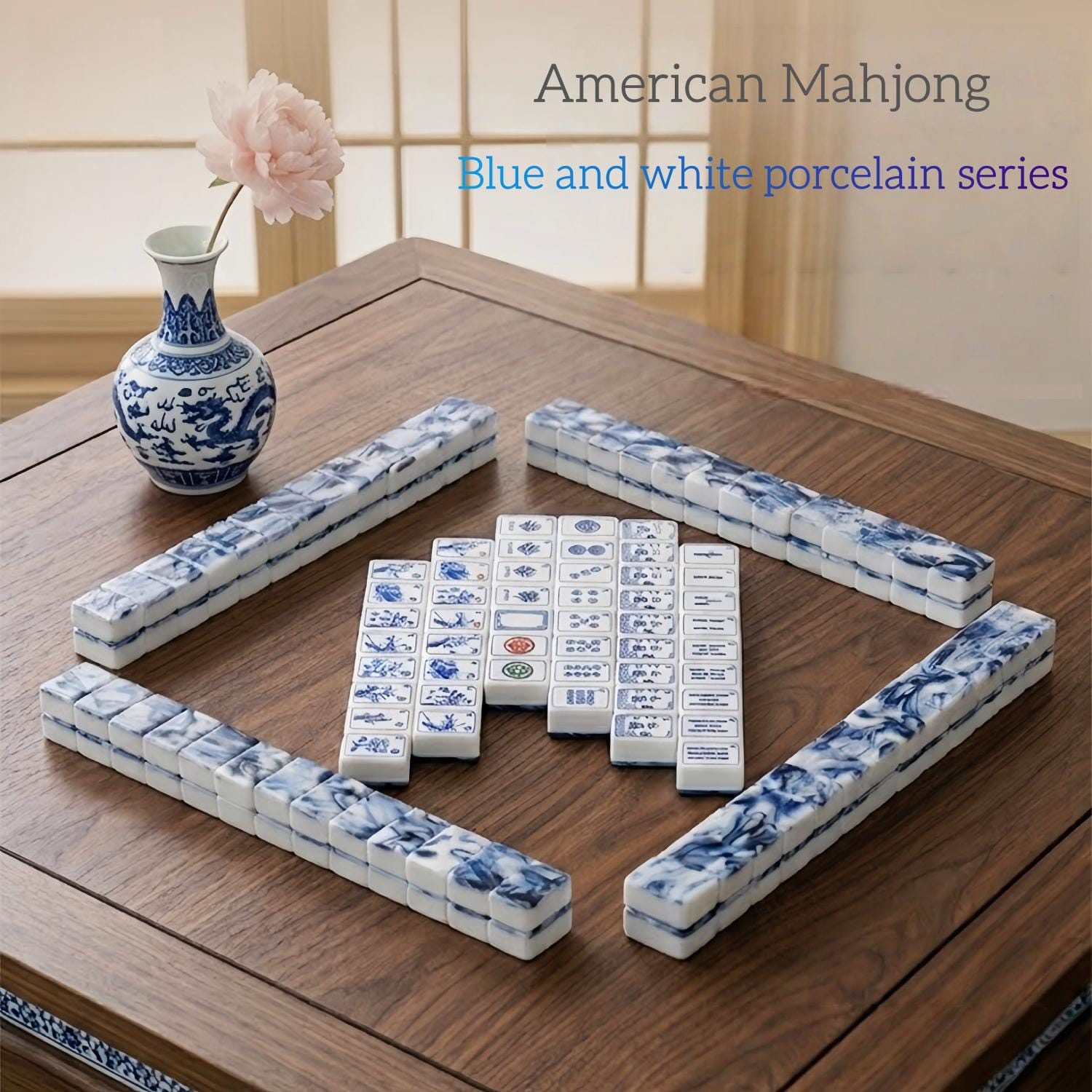 Blue and white porcelain American mahjong set with 160 cobalt-blue tiles arranged around a porcelain vase
