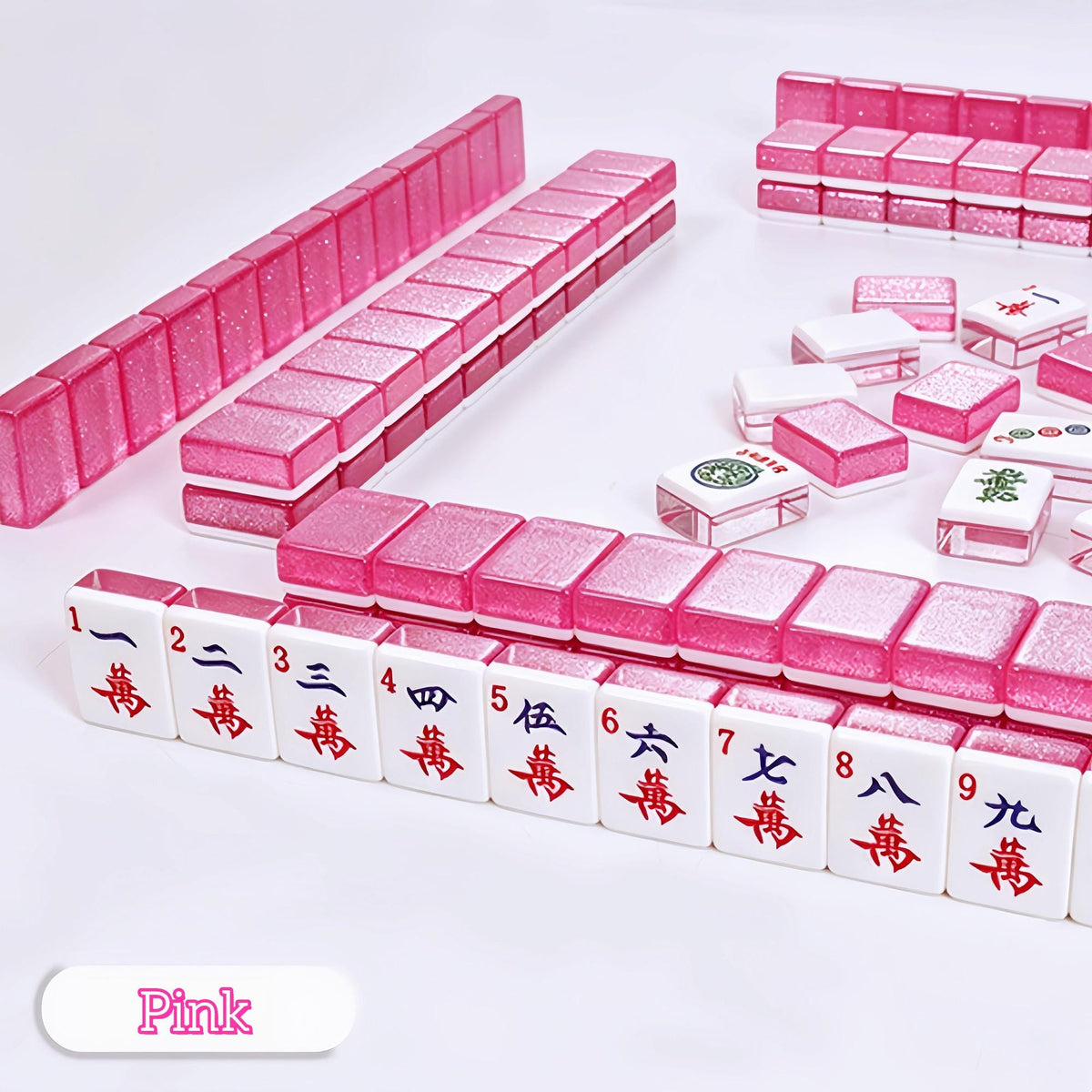 Crystal Shimmer Pink mahjong set, full wall build with pink glitter translucent backs, white character suit tiles 1 wan through 9 wan, pink color label, American mahjong tiles