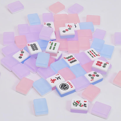 Jelly Macaron translucent glossy American mahjong tiles scattered on white background, semi-transparent pink purple blue jelly macaron backs, tile faces with joker, season, dot and bamboo mahjong symbols