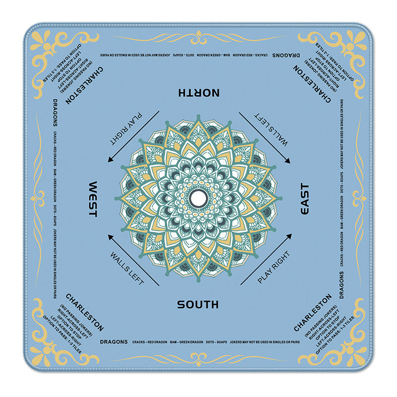 Light sky blue square mahjong mat, delicate green-gold mandala pattern, printed North South East West directions and Charleston rule text