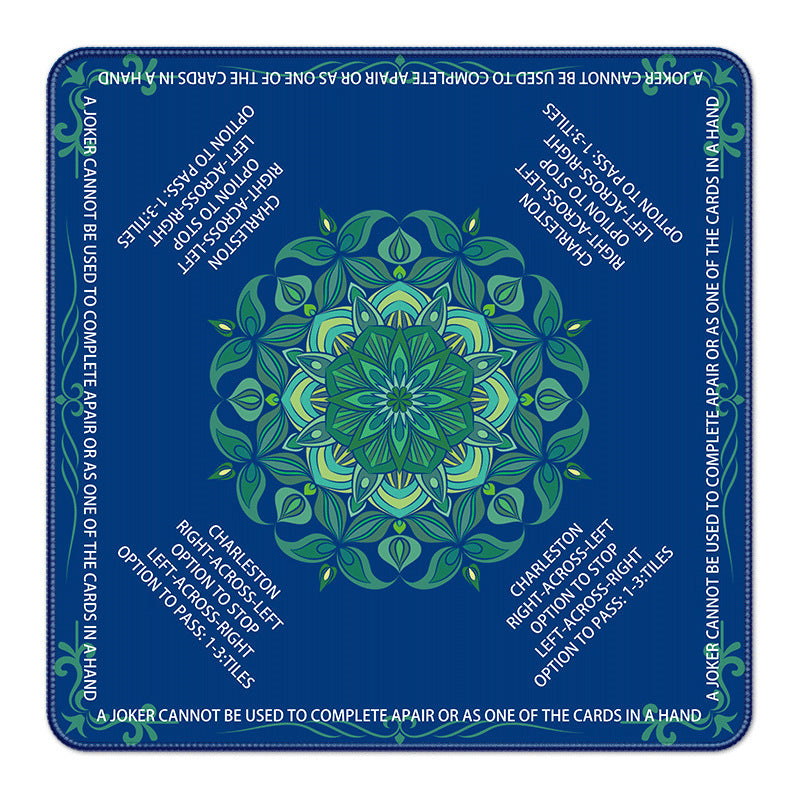 Deep navy blue American mahjong mat with vibrant green mandala flower motif and printed Charleston and joker rule text