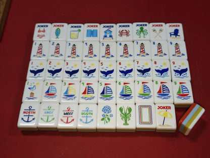 oastal_Breeze_Mahjong_Tiles_Set_Glossy_Orange_Summer-Striped_Tile_Backs_with_Nautical_Lighthouse_Dot_Whale-Tail_Bamboo_Sailboat_Character_Anchor_Wind_Beach-Vacation_Joker_American_Mahjong_Suit_Art
