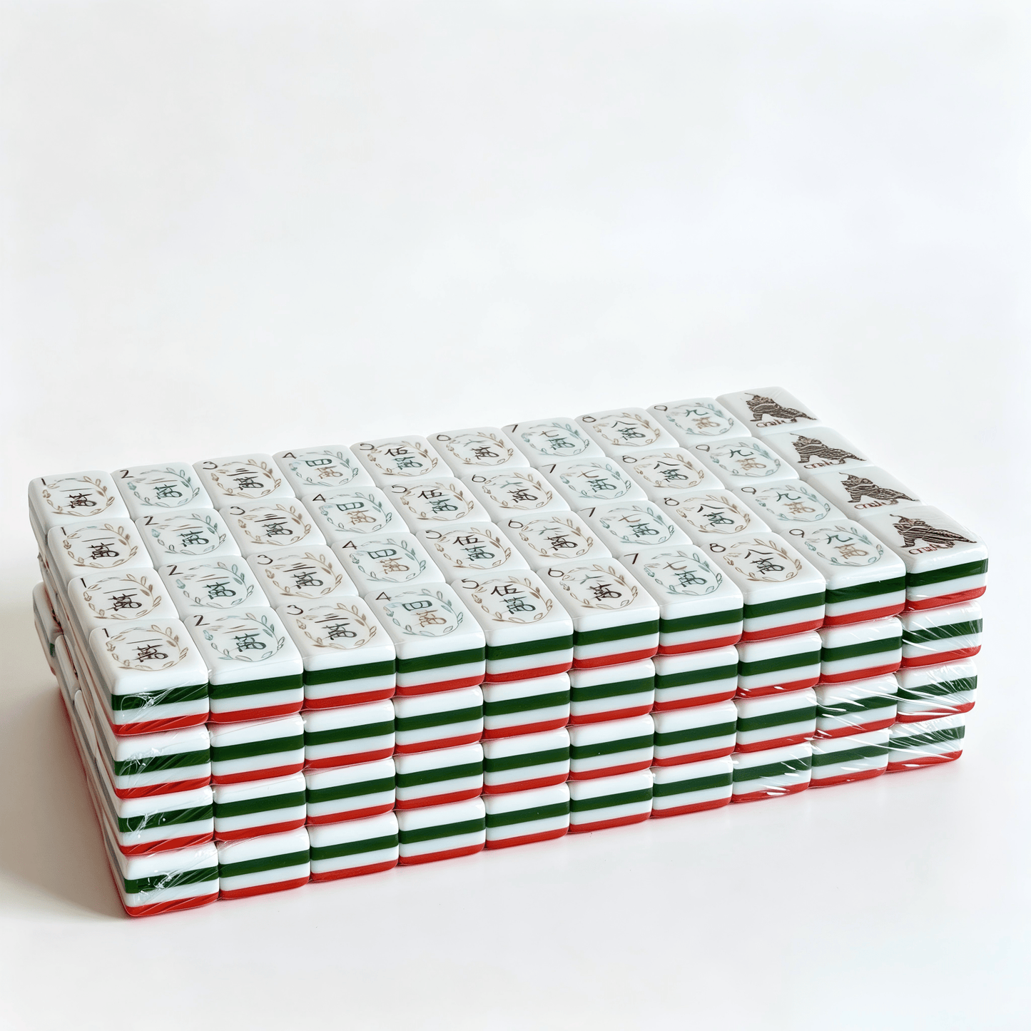 Side profile of 32g weighted Coral Reef American Mahjong tiles by USA Mahjong Co., showcasing vibrant coral red backs