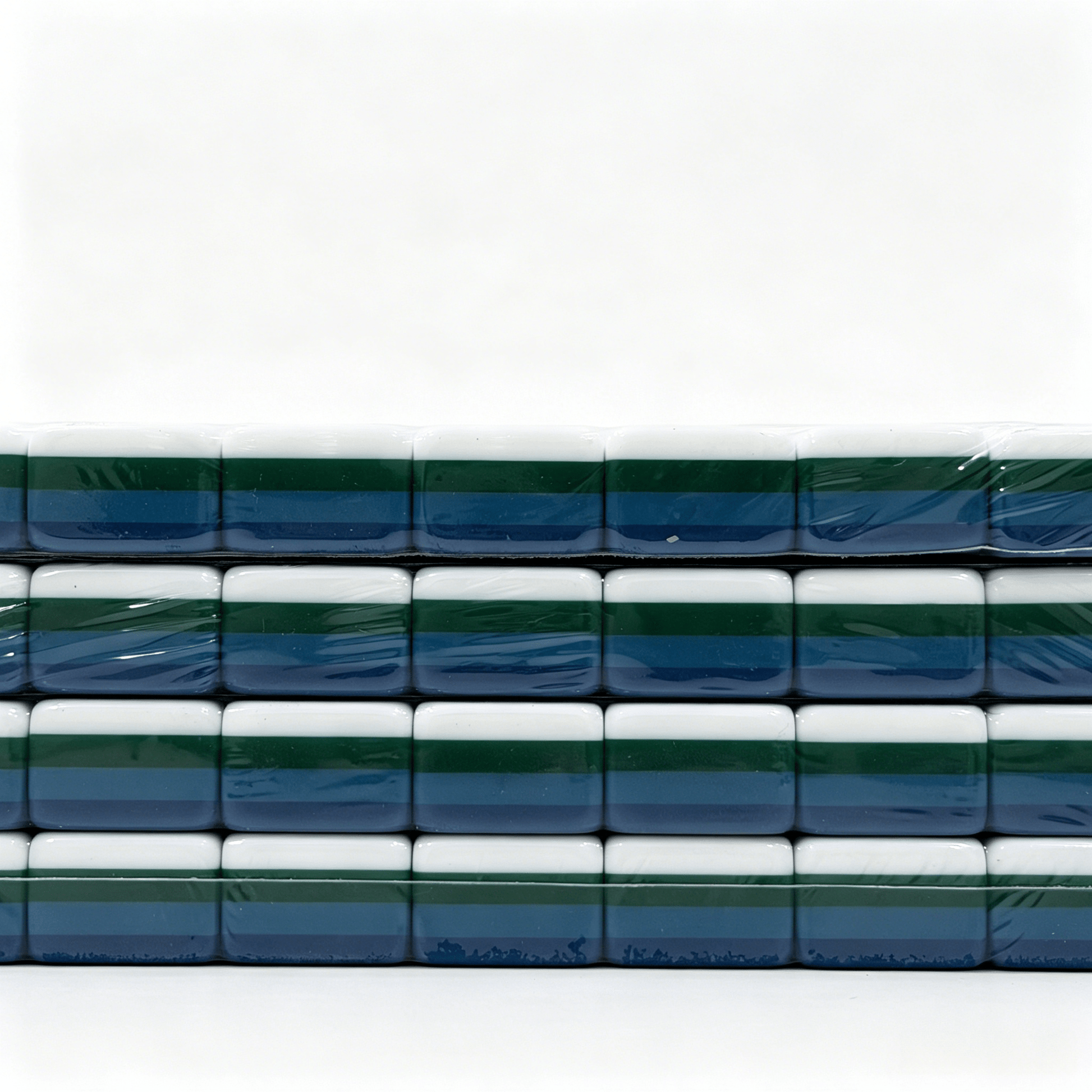 Side profile of 32g weighted teal Mahjong tiles with deep petrol backs from the USA Mahjong Co. American Mahjong Set.