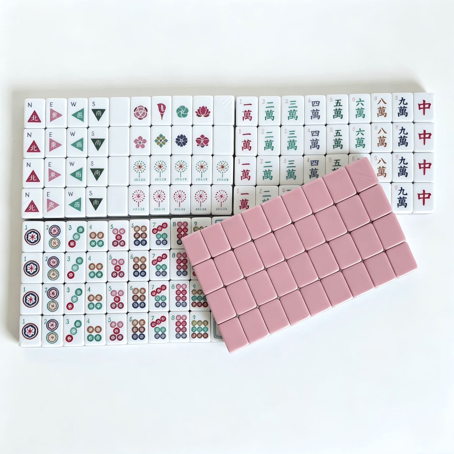 Dusty Rose American Mahjong Set by USA Mahjong Co. with 160 weighted tiles, blush backs, and compass wind design.