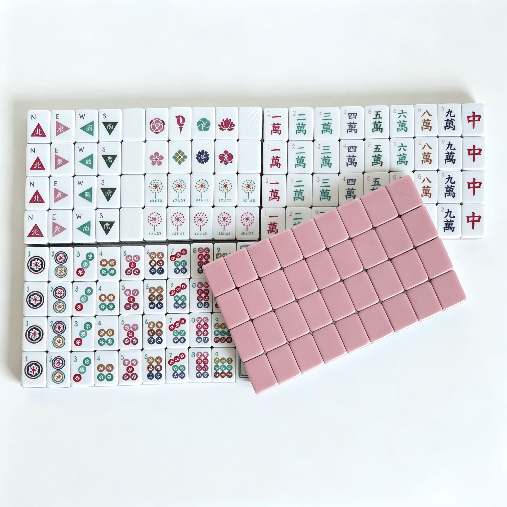 Dusty Rose American Mahjong Set by USA Mahjong Co. with 160 weighted tiles, blush backs, and compass wind design.