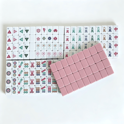 Dusty Rose American Mahjong Set by USA Mahjong Co. with 160 weighted tiles, blush backs, and compass wind design.