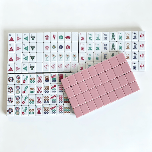 Dusty Rose American Mahjong Set by USA Mahjong Co. with 166 weighted tiles, blush backs, and compass wind design.