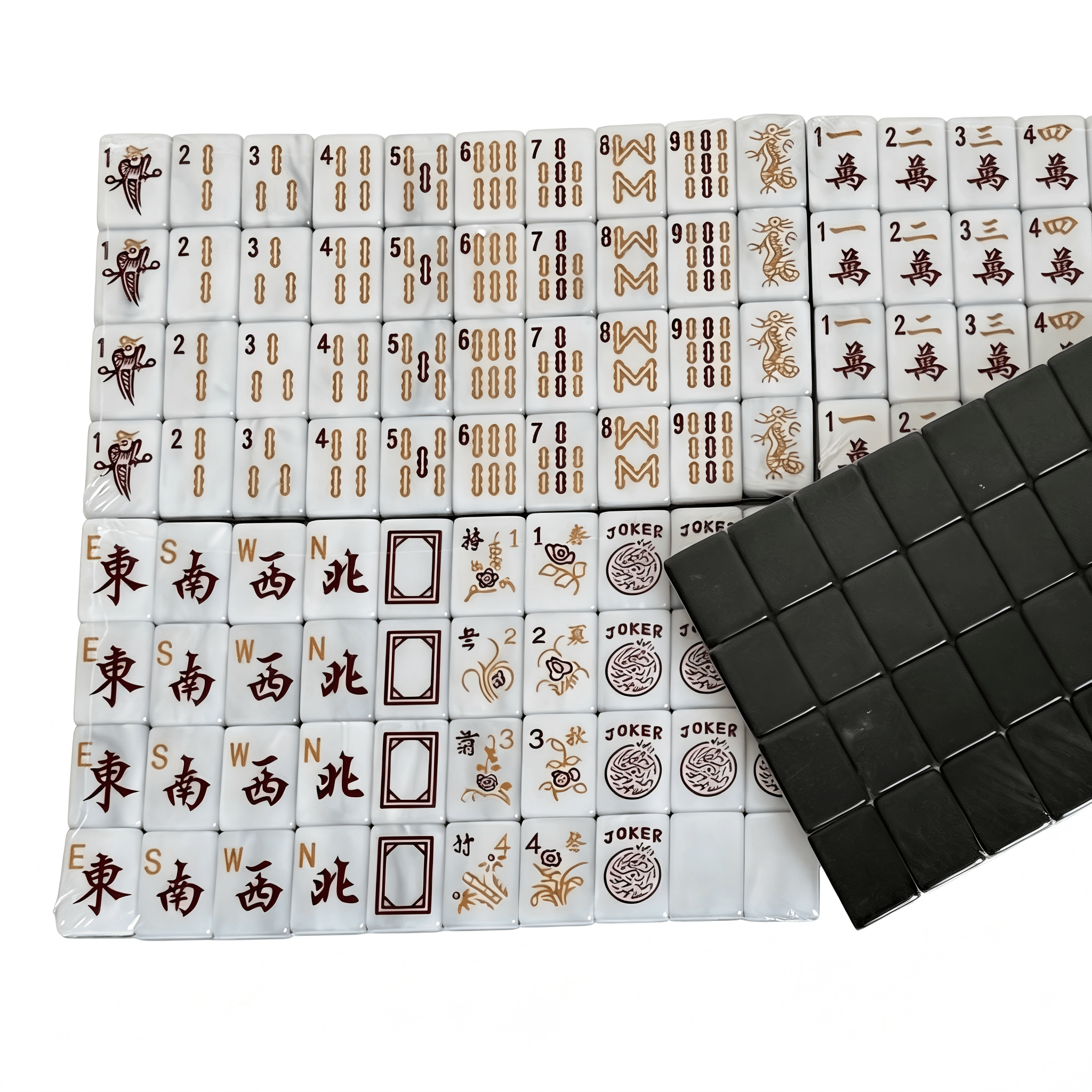 Professional black and gold American mahjong tile set on a table, ready for a scored game