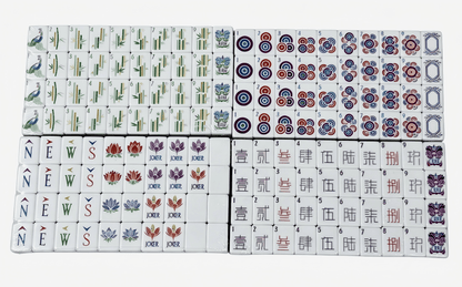 American Mahjong Set by USA Mahjong Co. with 166 weighted tiles featuring creamy ivory backs and compass wind design.