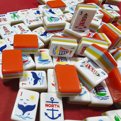 oastal_Breeze_Mahjong_Tiles_Set_Glossy_Orange_Summer-Striped_Tile_Backs_with_Nautical_Lighthouse_Dot_Whale-Tail_Bamboo_Sailboat_Character_Anchor_Wind_Beach-Vacation_Joker_American_Mahjong_Suit_Art